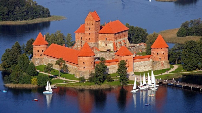 Trakai Island Castle on a lake with sailboats