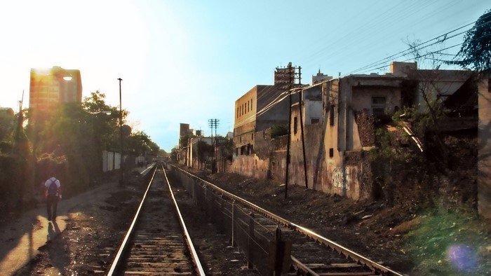 Person walking along train tracks