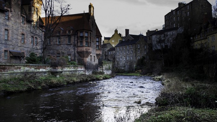 River flowing through old stone buildings