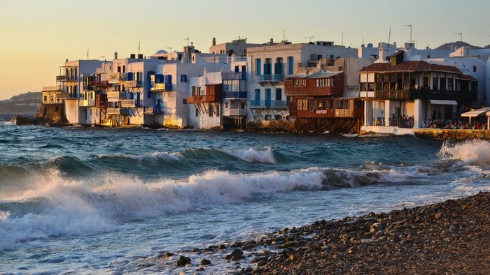 Mykonos Greece waterfront buildings and waves