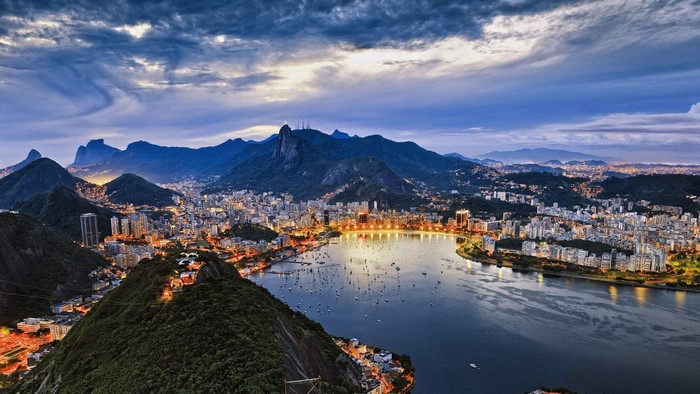 Rio de Janeiro cityscape with mountains and bay at dusk