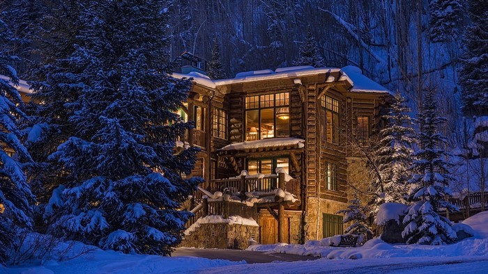 Luxury log cabin in Colorado mountains during winter