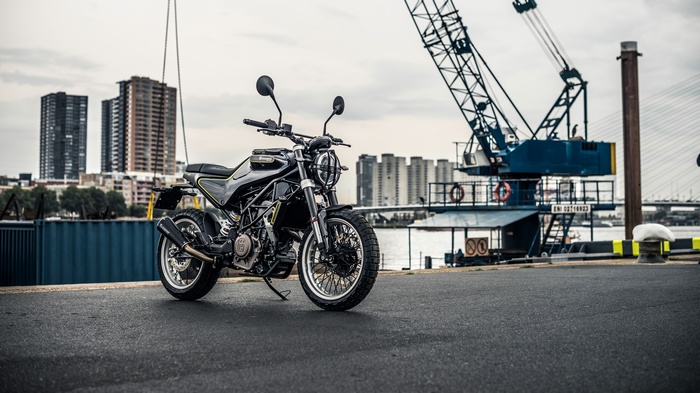 Husqvarna Svartpilen 401 motorcycle in industrial harbor