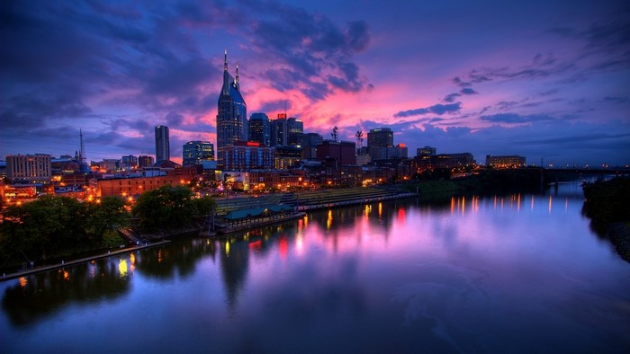 Nashville skyline at sunset with river reflection