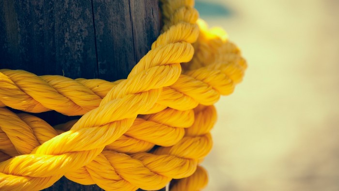 Yellow Rope Tied Around Wooden Post
