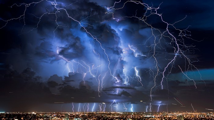 Giant Lightning Strikes Over City at Night