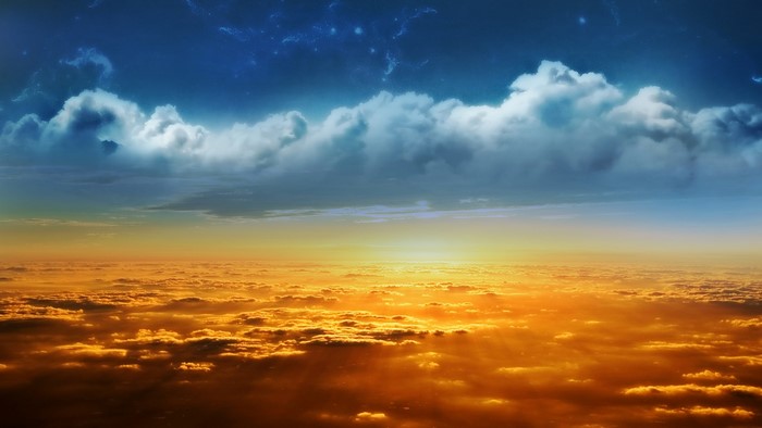 Sunset over clouds with stars