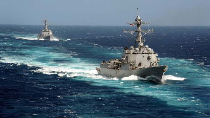 Two US Navy destroyers sailing in the ocean