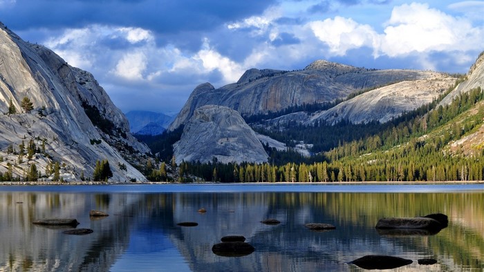 Mountain lake with reflections and dramatic clouds
