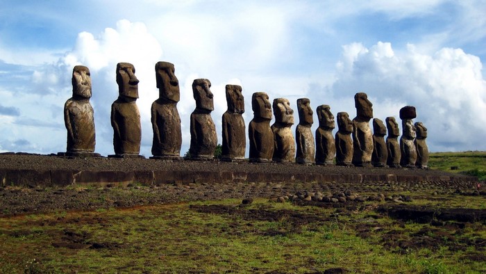 Moai statues on Easter Island under a cloudy sky