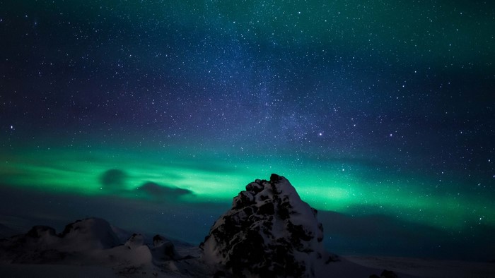 Northern Lights over Iceland Mountains