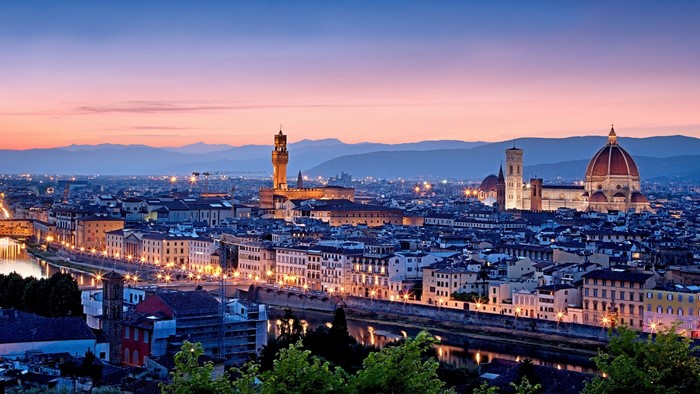Florence cityscape at dusk with Arno River and mountains