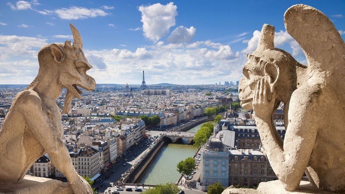 Gargoyles overlooking Paris with Eiffel Tower
