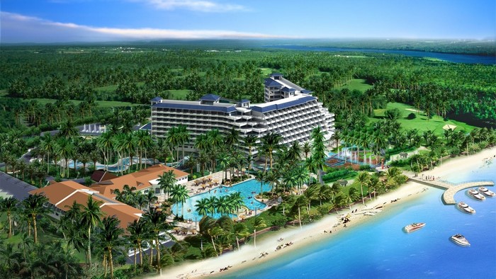 Tropical resort with hotel, pool, beach, and boats