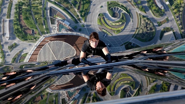 Tom Cruise climbing a skyscraper