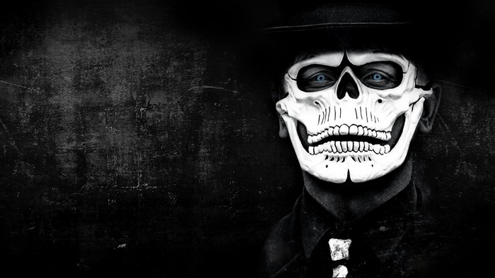 Man in Skull Mask and Hat