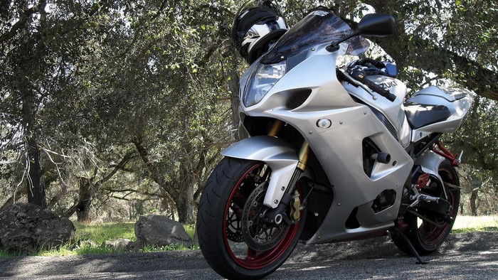 Silver Suzuki Superbike Motorcycle with Helmet
