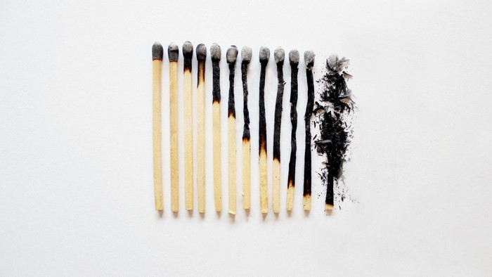 Burnt and unburnt matchsticks arranged in a row