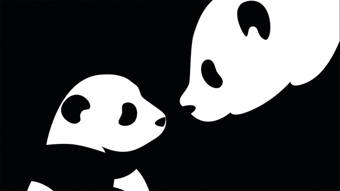 Two pandas face each other in monochrome