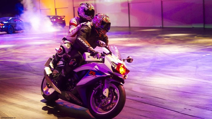 Two people on a Suzuki GSX-R motorcycle