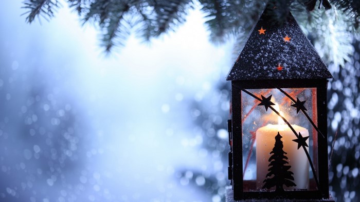 Christmas lantern with candle and pine branches