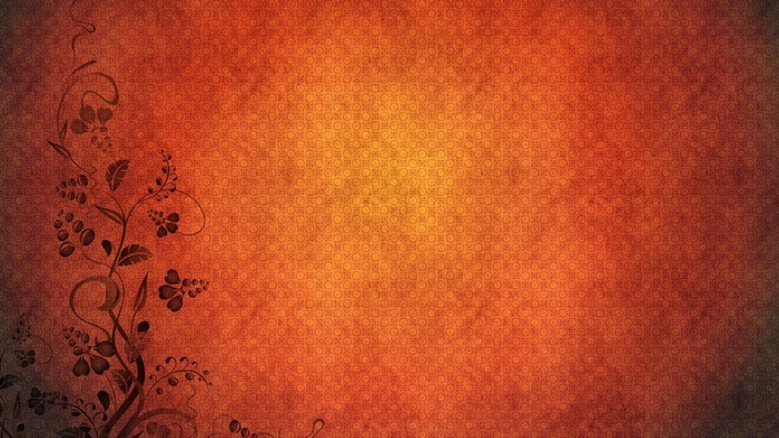 Orange textured background with floral vine