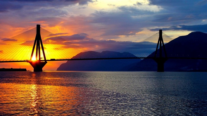 Cable-stayed bridge at sunset over water