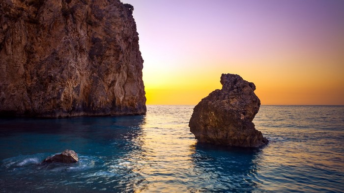 Rocky coast with ocean at sunset