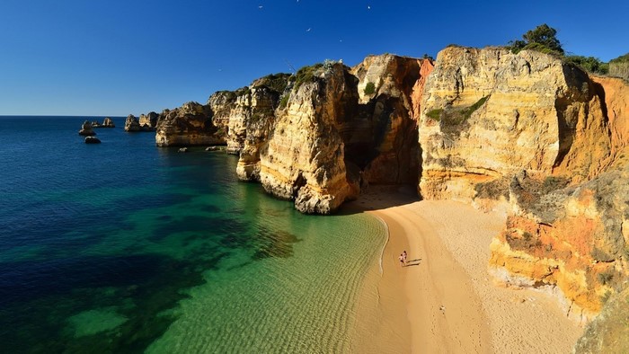 Secluded beach with cliffs and turquoise water