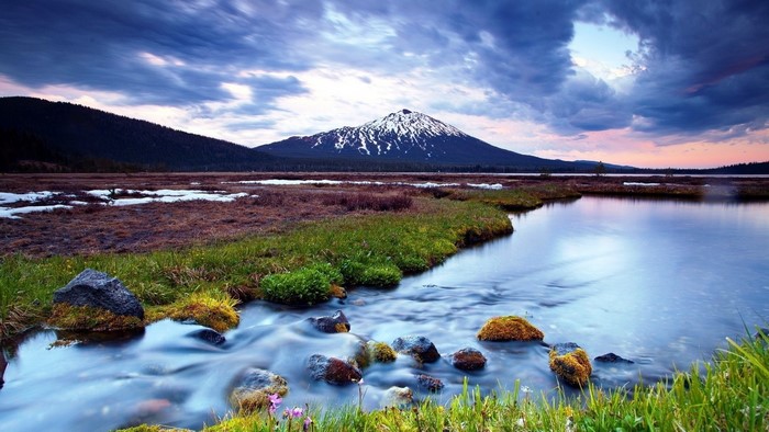 Mountain landscape with river and snow