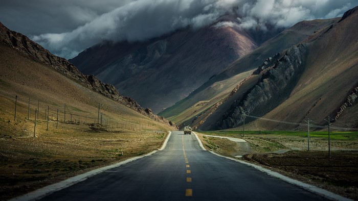 Car on a road through a mountain pass