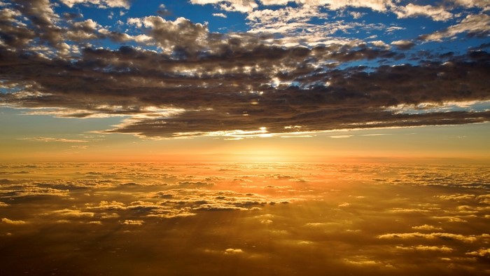 Golden Sunset Over Clouds