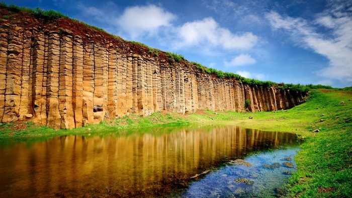 Columnar Basalt Cliff Overlooking a Pond
