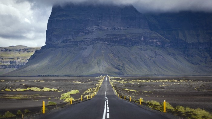 Road leading to a large mountain in Iceland