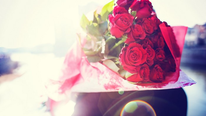 Bouquet of red roses with pink wrapping