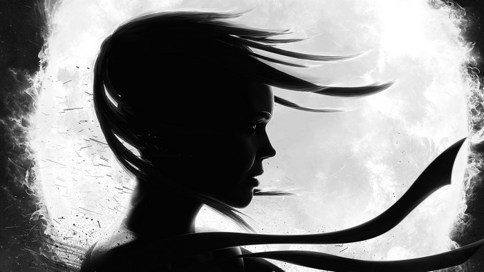 Silhouette of a woman with flowing hair against a bright background
