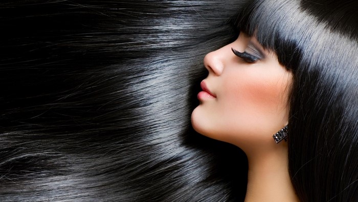 Woman with long black hair and makeup