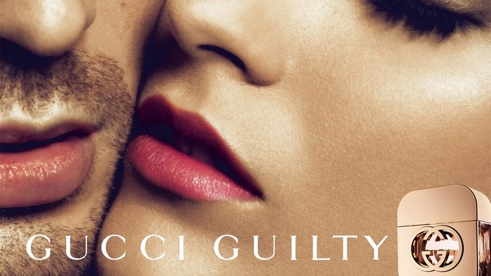 Gucci Guilty Perfume bottle and couple