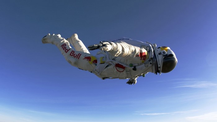 Felix Baumgartner in Red Bull Stratos suit skydiving