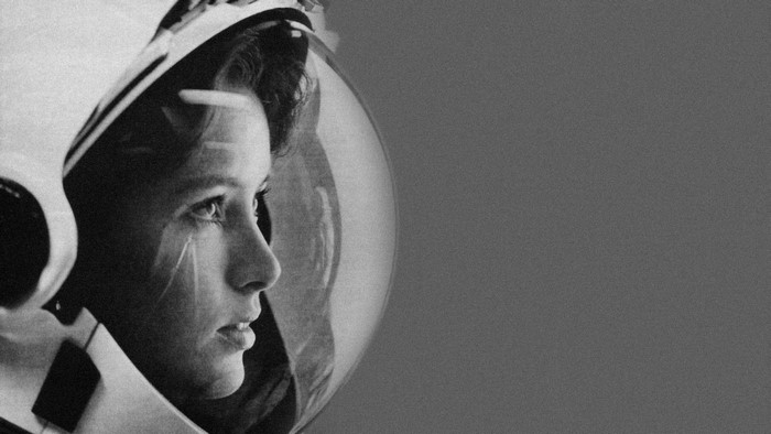 Young woman in astronaut helmet