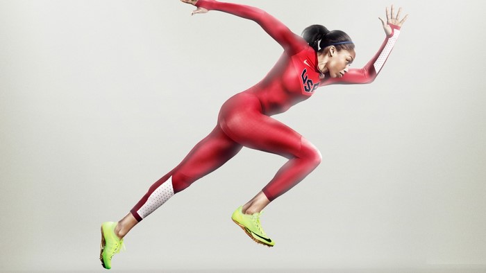 Woman in red Nike USA running suit