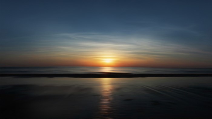 Sunset reflections on a beach