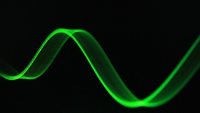 Green streak on black background