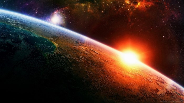 Sunrise over planet Earth in colorful space