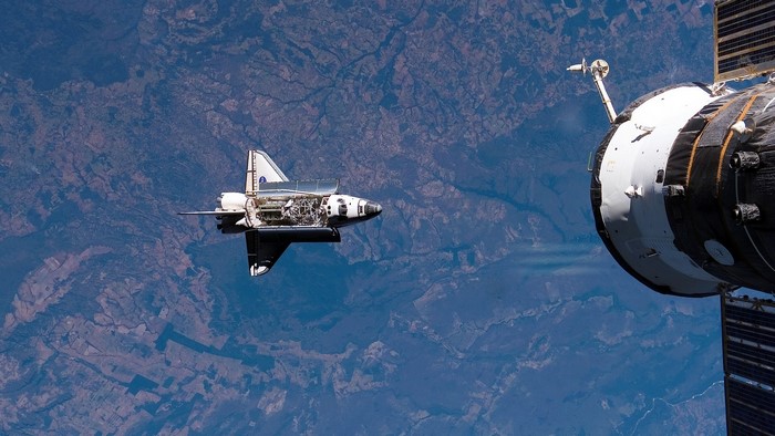 Space Shuttle Discovery docked with International Space Station