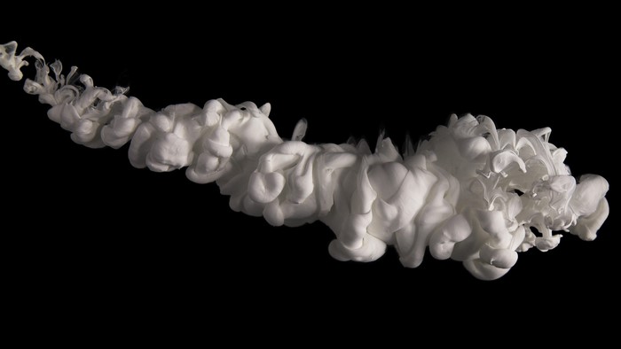 White ink cloud in black background