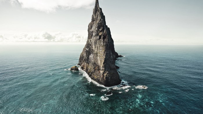 Tall rock formation in the ocean