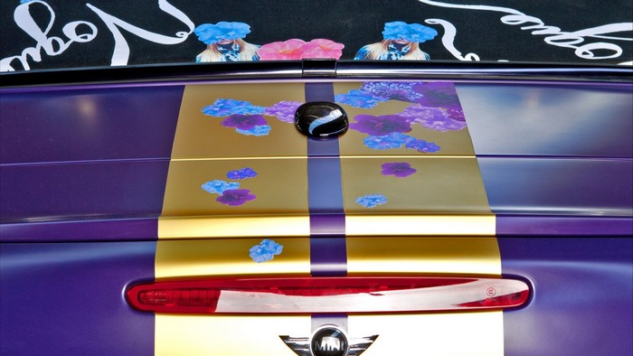 Mini Cooper with floral design and gold stripes