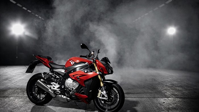 Red BMW S1000R motorcycle in smoke