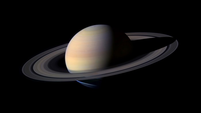 Saturn and its rings in space